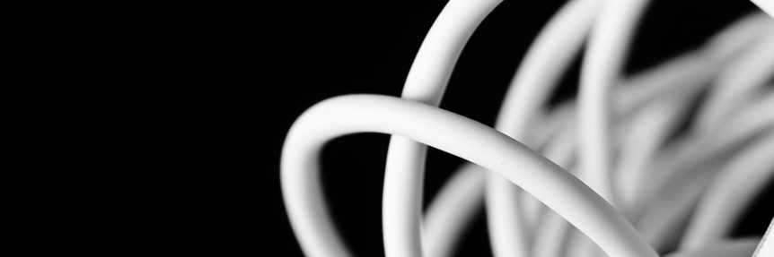 white cables against a black background
