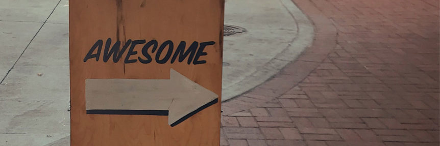 sidewalk sign saying "awesome"